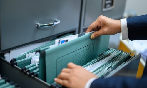 Employees are managing documents at the office. Employees are managing documents at the office.